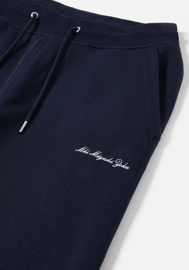 Shop MKI EMBROIDERED EMBASSY JOGGERS Navy MKI MIYUKI ZOKU Trousers