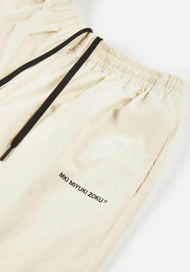 Shop MKI FLORAL COTTON LINEN SHORTS Ecru MKI MIYUKI ZOKU Shorts