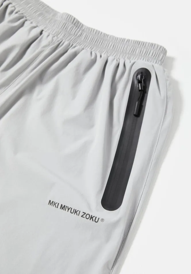 Shop MKI LIGHTWEIGHT SHELL TRACK PANTS Light Grey MKI MIYUKI ZOKU Trousers