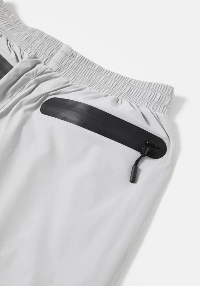 Shop MKI LIGHTWEIGHT SHELL TRACK PANTS Light Grey MKI MIYUKI ZOKU Trousers