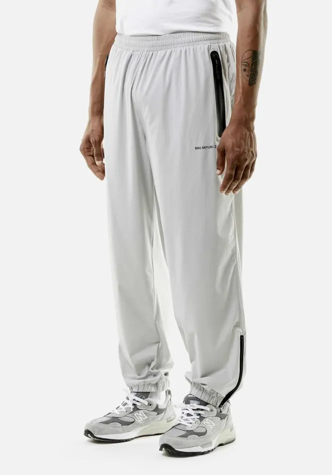 Shop MKI LIGHTWEIGHT SHELL TRACK PANTS Light Grey MKI MIYUKI ZOKU Trousers
