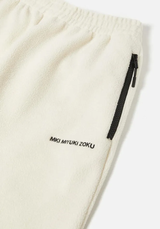Shop MKI POLAR FLEECE TRACK PANTS Off White MKI MIYUKI ZOKU Trousers