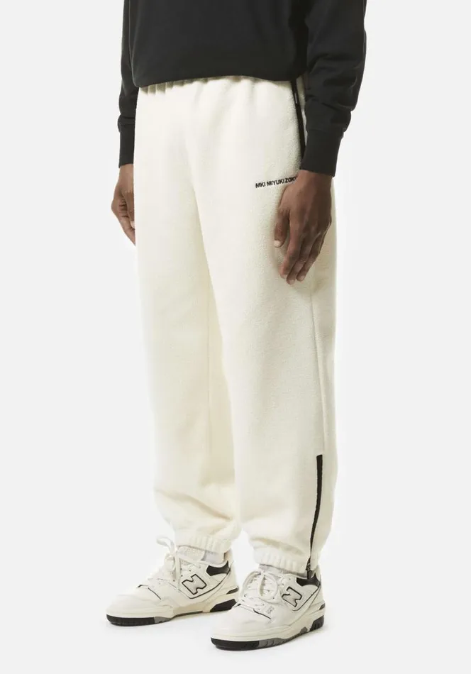 Shop MKI POLAR FLEECE TRACK PANTS Off White MKI MIYUKI ZOKU Trousers