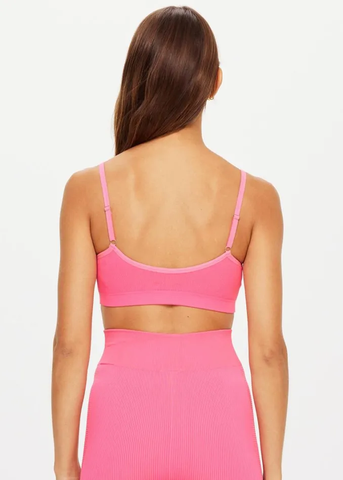 The Upside RIBBED SEAMLESS BALLET BRA Neon Pink Shop Sports Bras The Upside RIBBED SEAMLESS BALLET BRA Neon Pink Shop Sports Bras