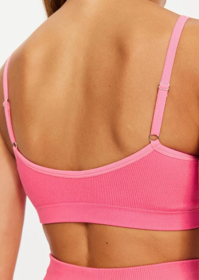 The Upside RIBBED SEAMLESS BALLET BRA Neon Pink Shop Sports Bras The Upside RIBBED SEAMLESS BALLET BRA Neon Pink Shop Sports Bras